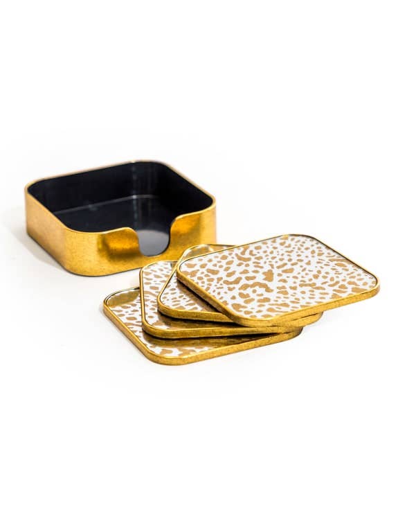 Set of square coasters with gold leopard print design on a white background