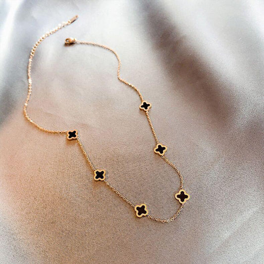 Six small clover necklace in black & gold