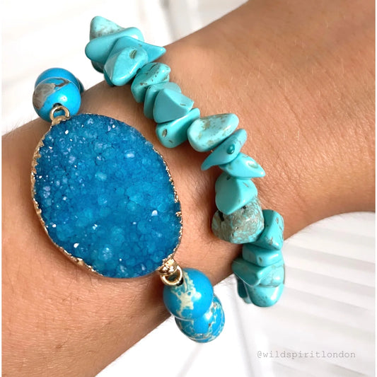 A set of 2 bright blue stretch bracelets made with blue Howlite stones.