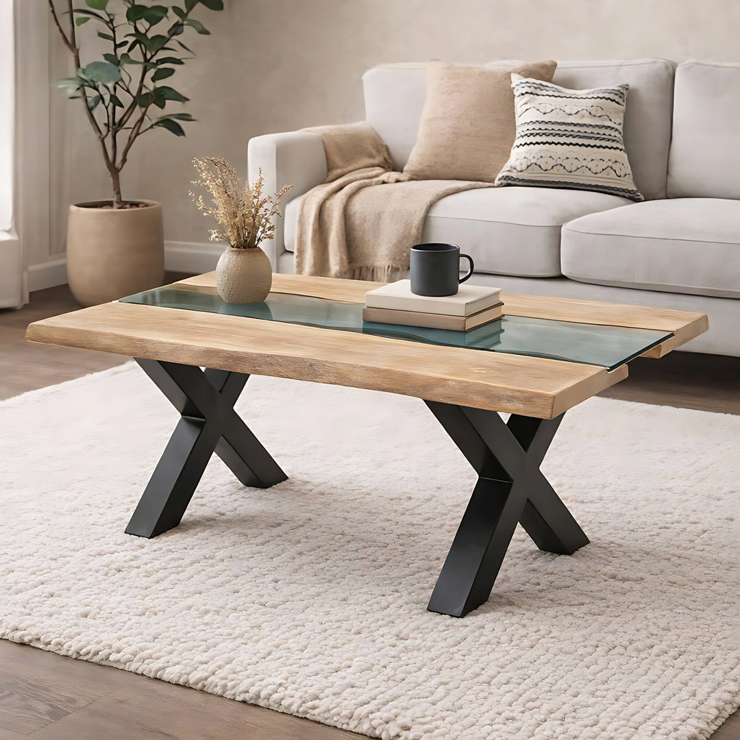 Coffee table with glass top and wooden surface in a living room setting