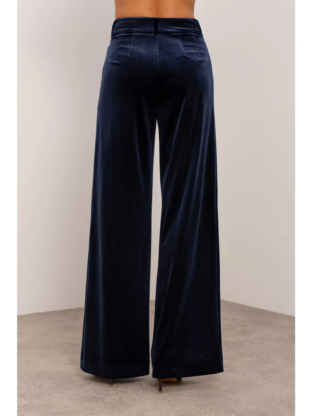 Navy blue wide-leg pants on a neutral background