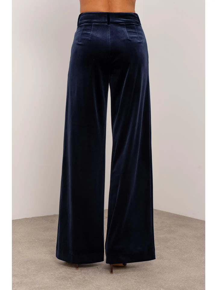 Navy blue wide-leg pants on a neutral background