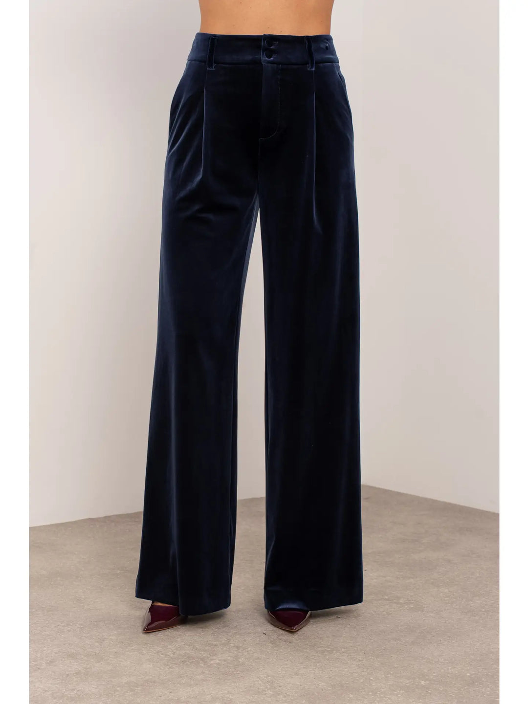 Navy blue wide-leg pants on a neutral background