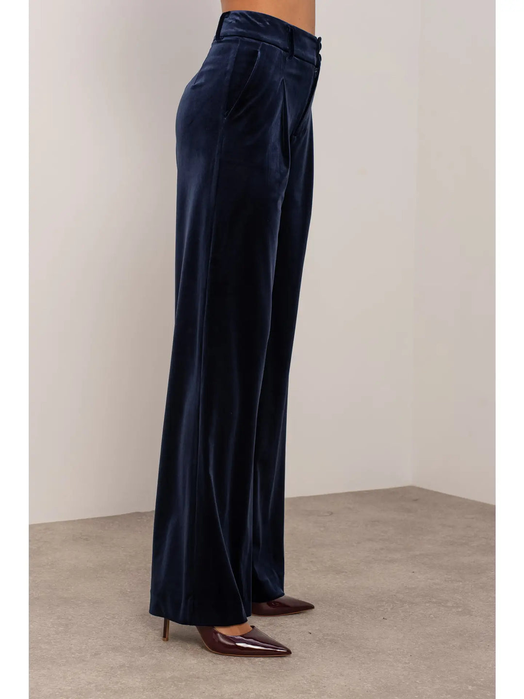 Navy blue wide-leg pants worn by a person on a plain background