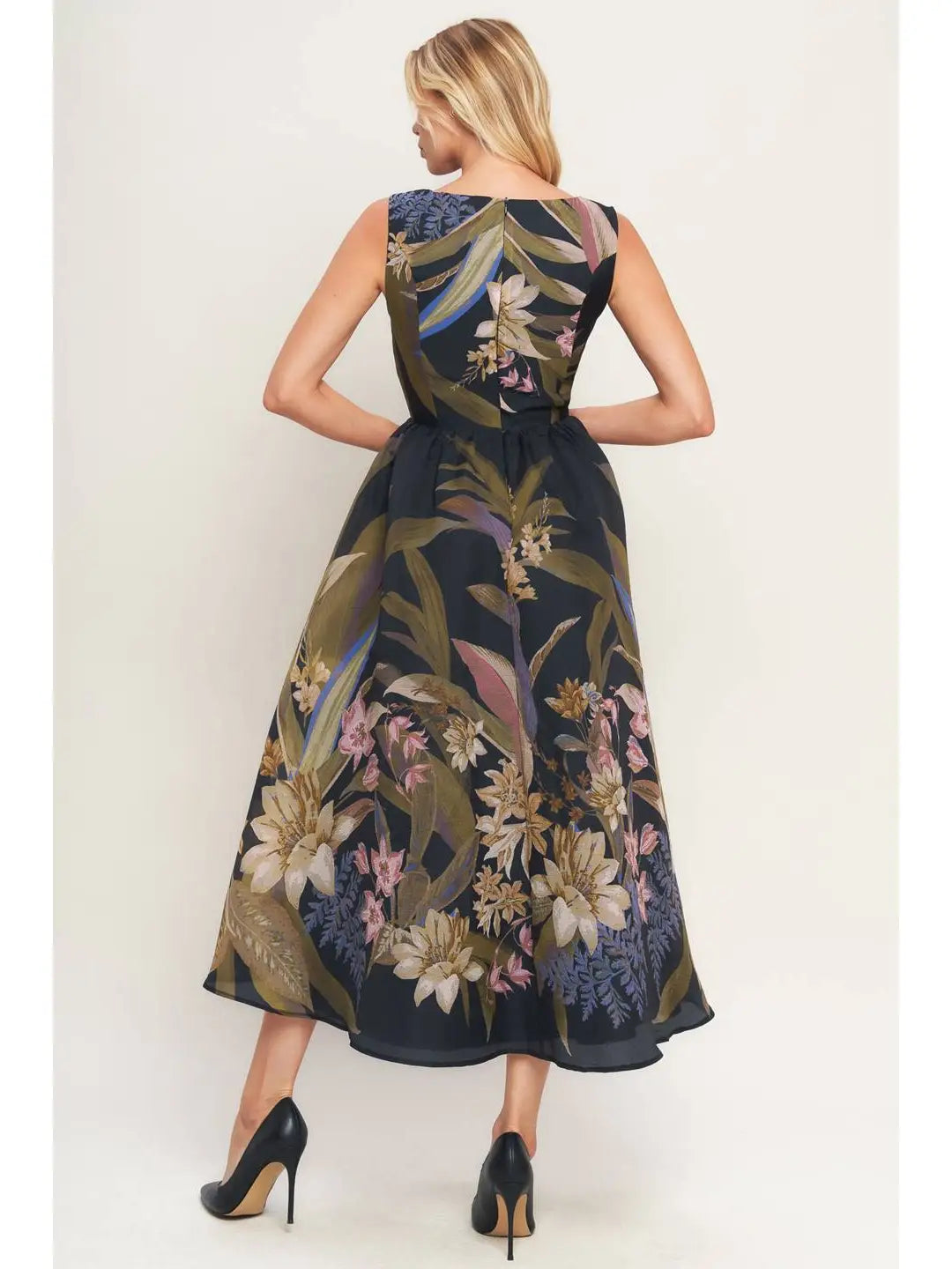 Woman wearing a floral dress with a white background