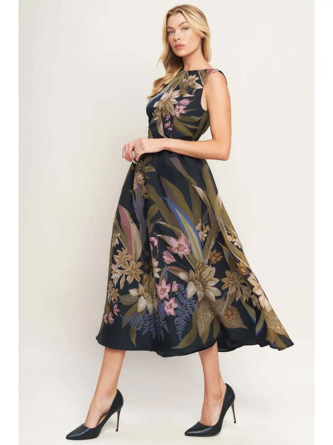 Woman wearing a floral dress with a plain background