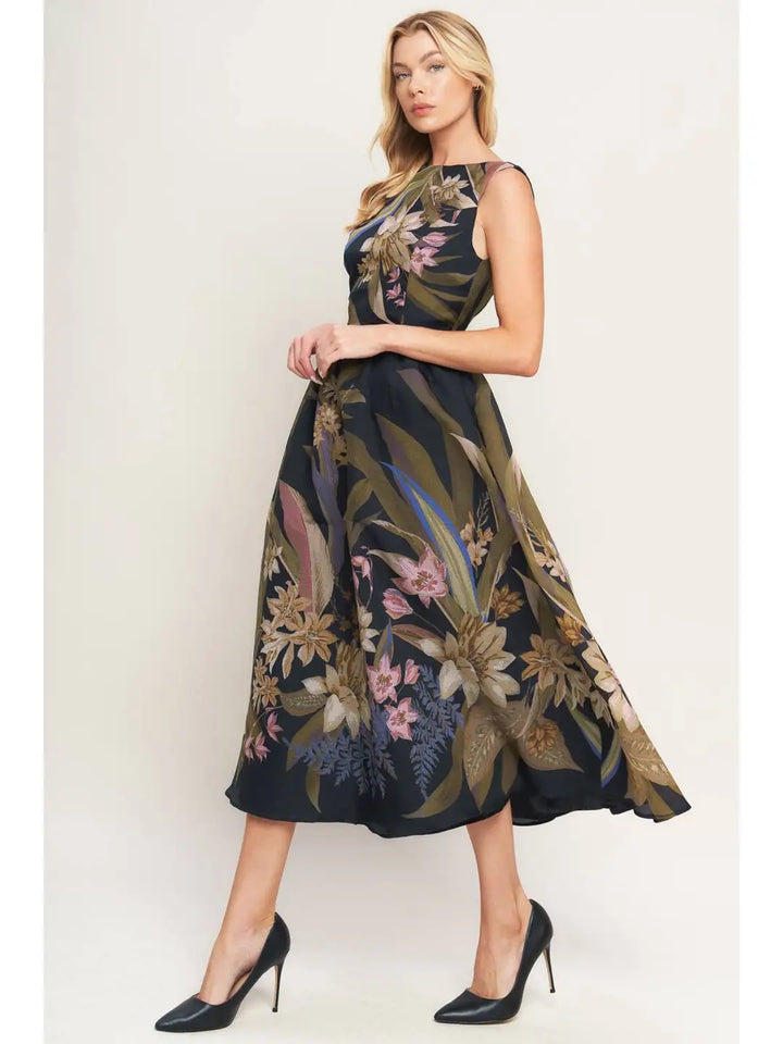 Woman wearing a floral dress with a plain background