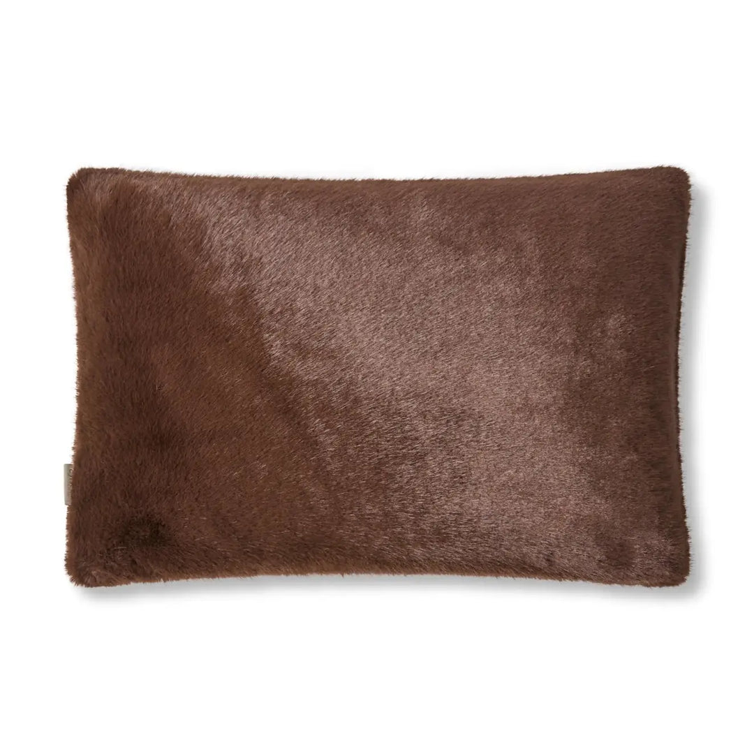A rectangular brown faux fur pillow with a soft, plush texture, shown against a plain white background.