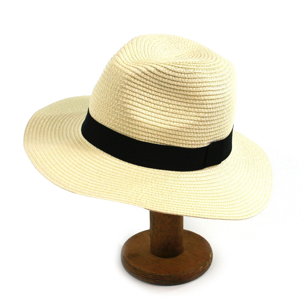 Beige straw hat with a black band on a wooden stand against a white background