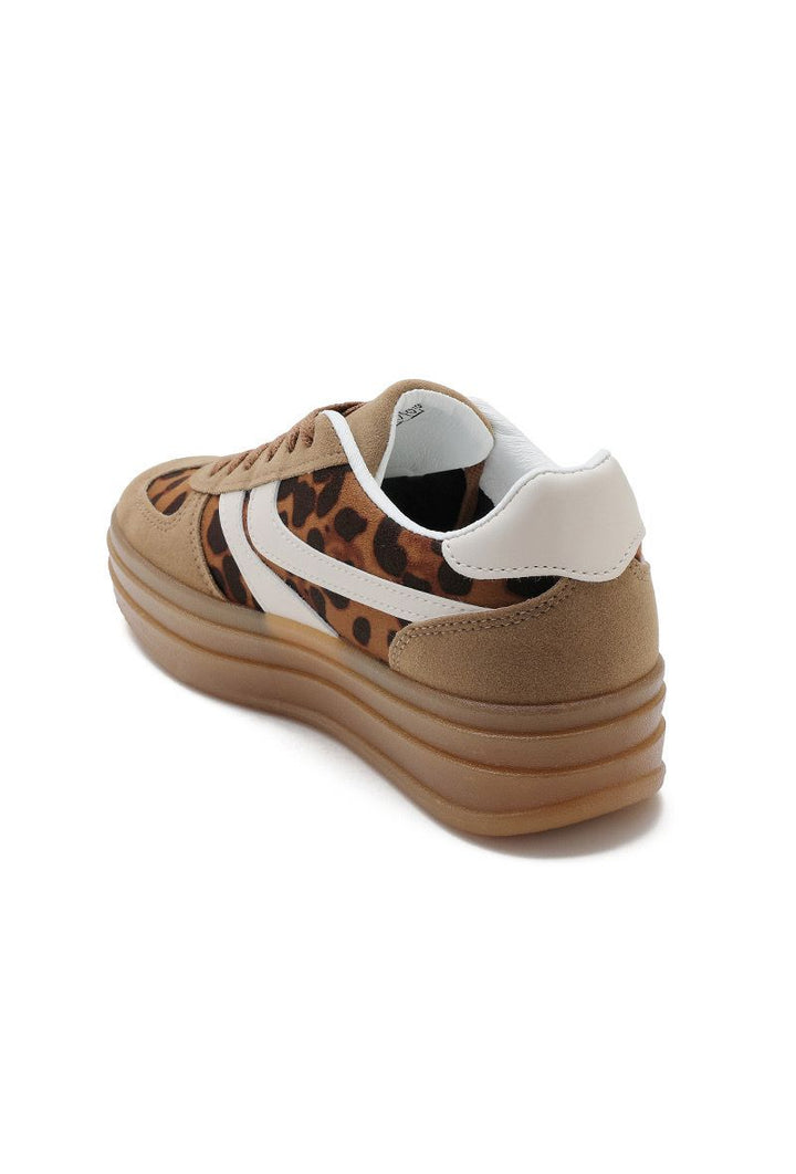 Brown sneaker with leopard print pattern on a white background