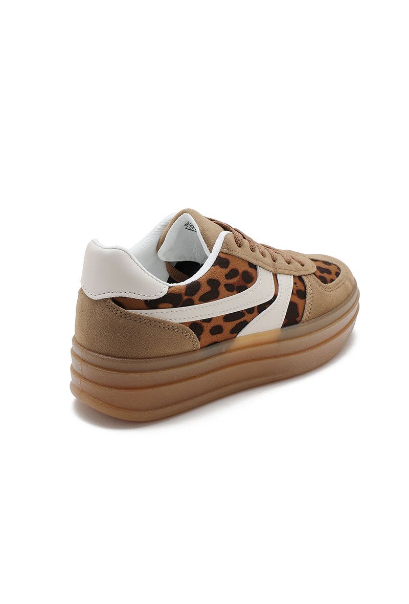 Tan sneaker with leopard print pattern on a white background