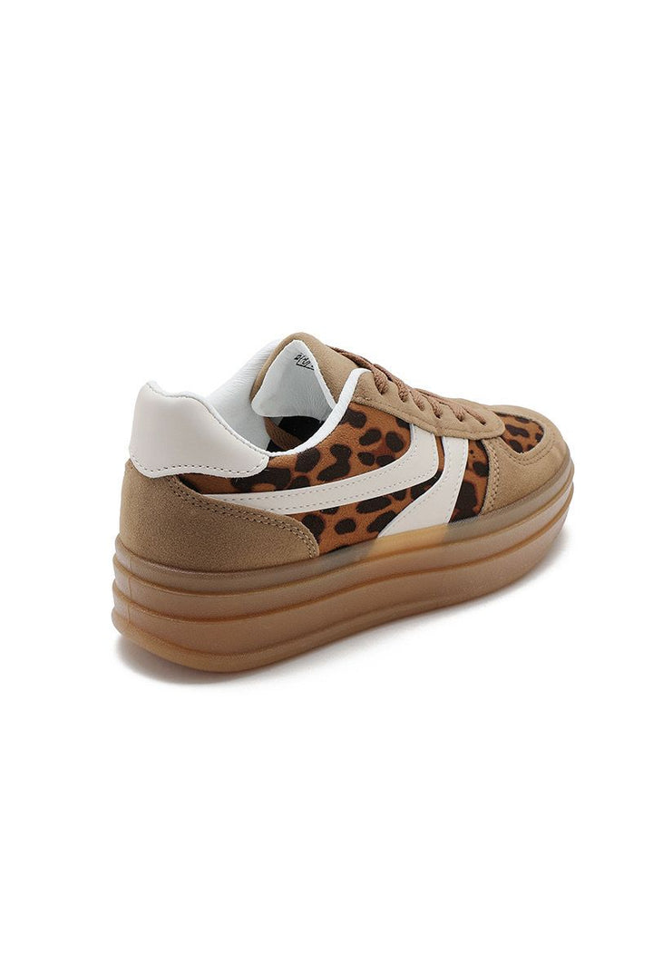 Tan sneaker with leopard print pattern on a white background