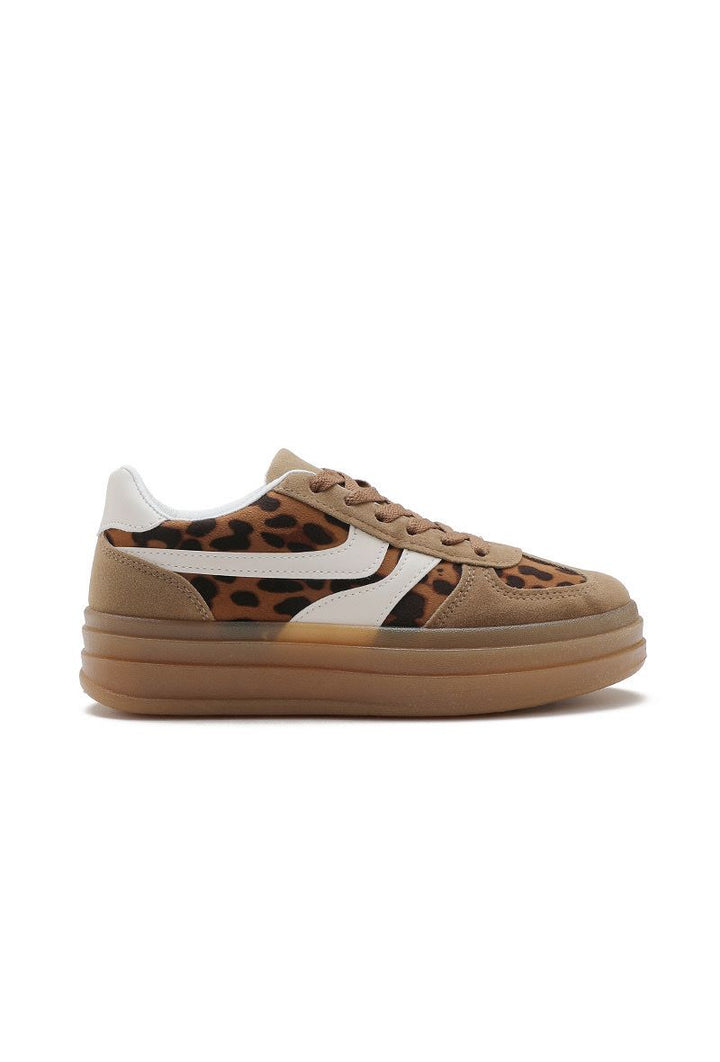 Tan sneaker with leopard print and white accents on a white background