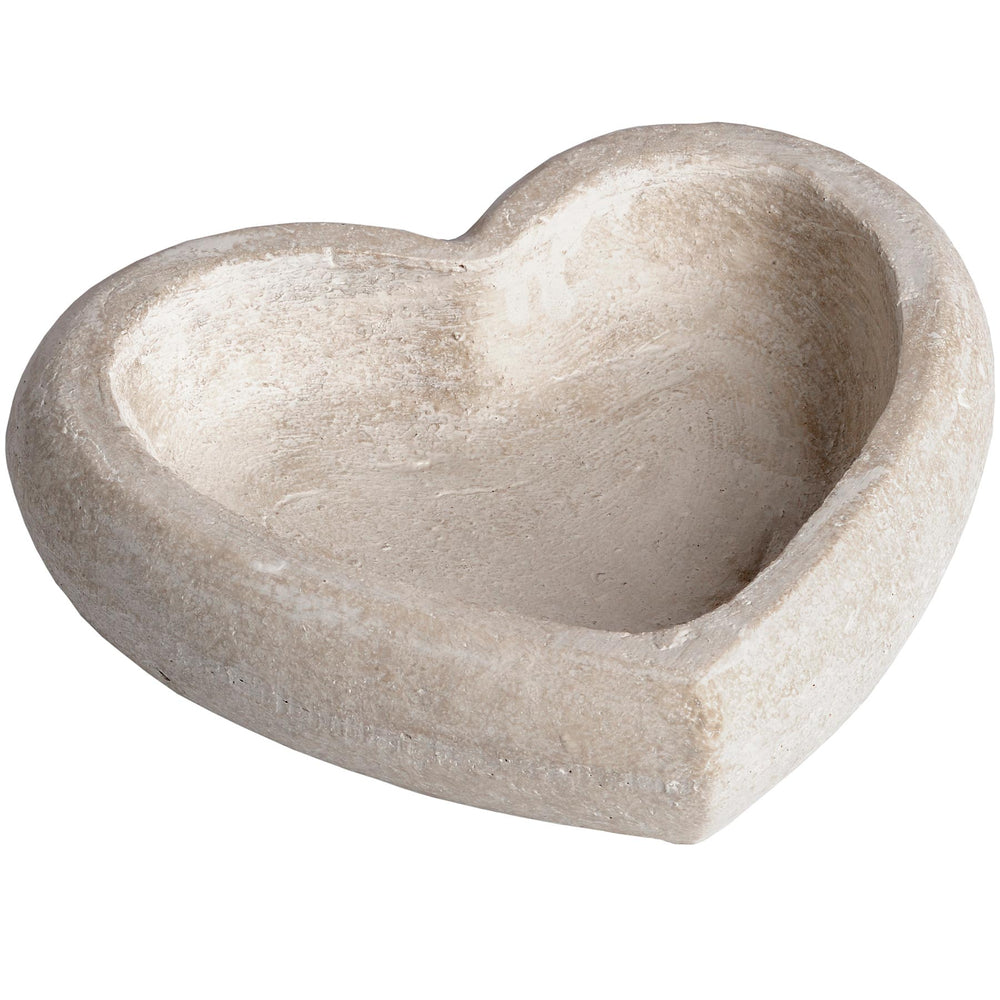 Heart-shaped stone bowl on a white background