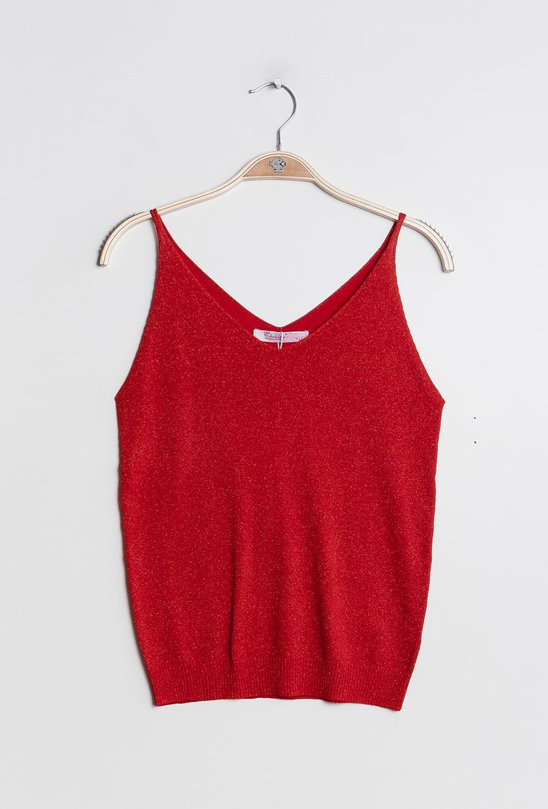 Red tank top on a hanger against a white background
