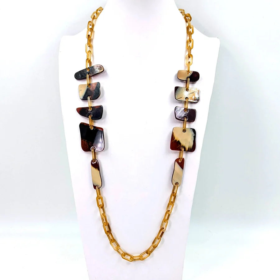 Necklace with square-shaped beads on a white background