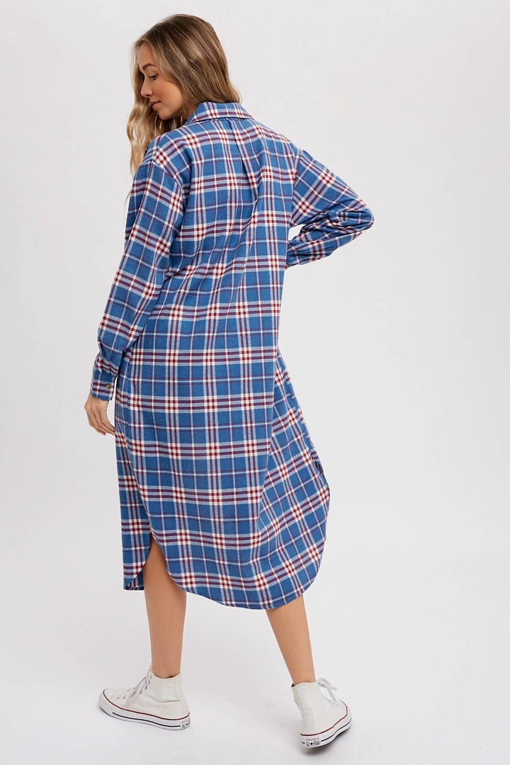 Woman wearing a blue plaid dress on a white background
