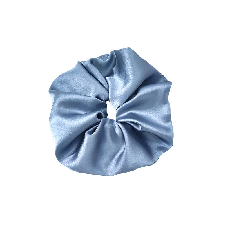 Blue satin scrunchie on a white background