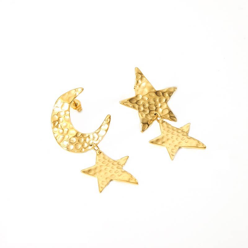 Gold earrings with star and moon designs on a white background