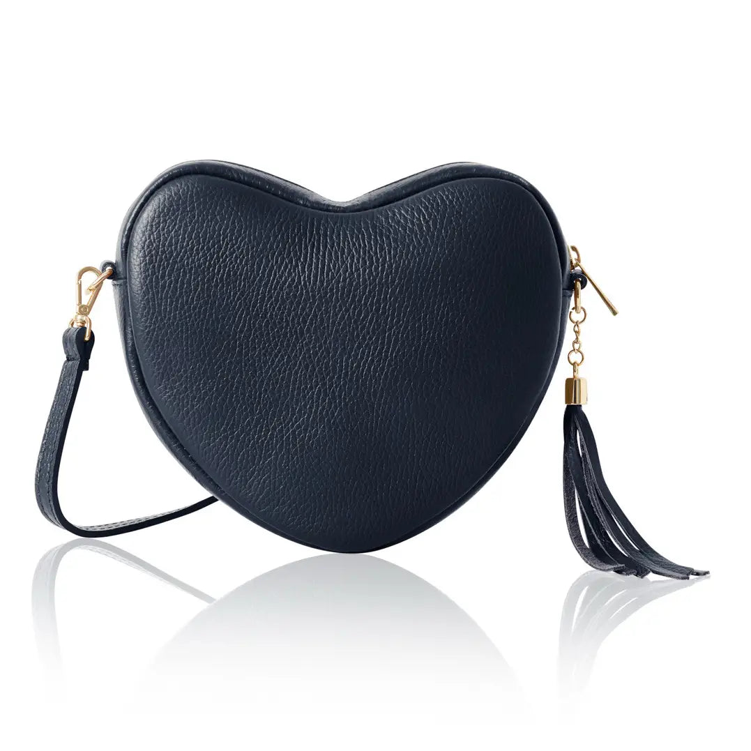 Heart-shaped black handbag with tassels on a white background