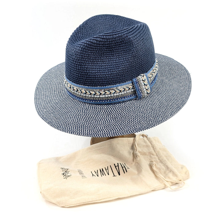 Blue straw hat with decorative band on a white background