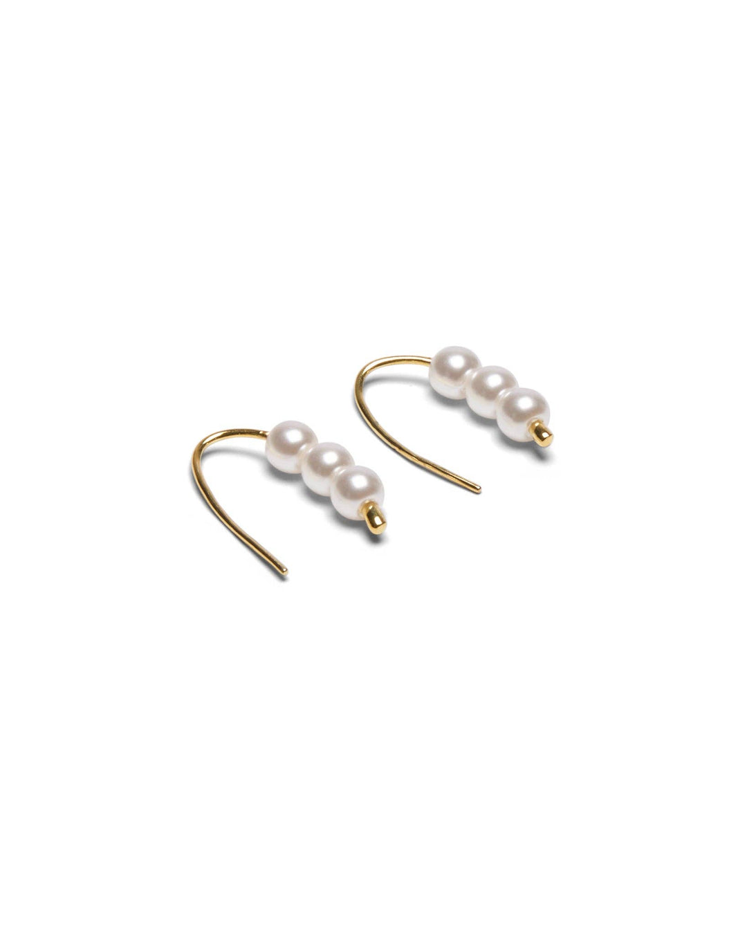 Pearl earrings with gold hooks on a white background