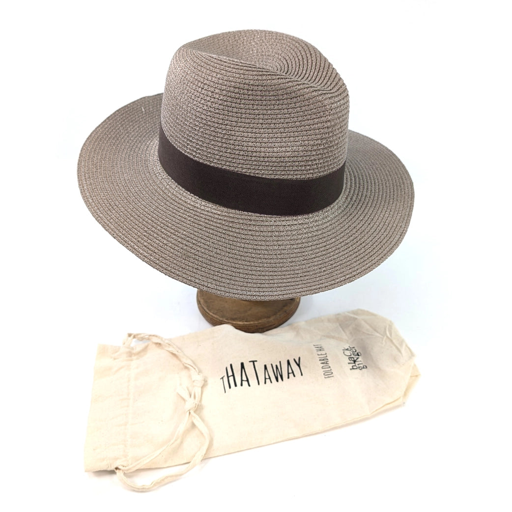 Gray straw hat with a black band on a wooden stand, accompanied by a beige carrying bag labeled 'THATaway' on a white background.