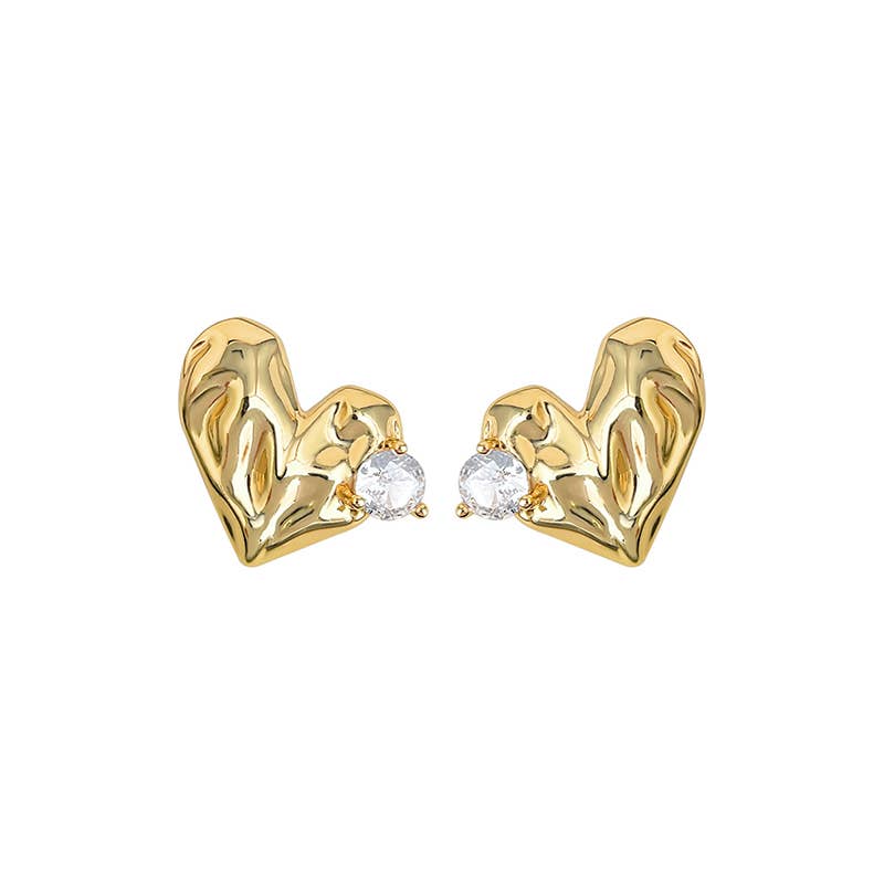 Gold heart-shaped earrings with clear gemstones on a white background