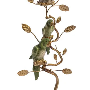 A decorative wall hanging or sculptural branch with two green birds perched on gold-toned branches and leaves, shown against a plain white background.