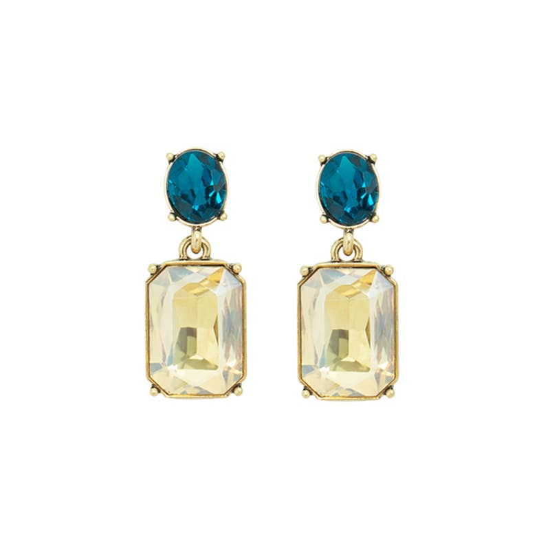 Pair of earrings with blue and clear gemstones on a white background