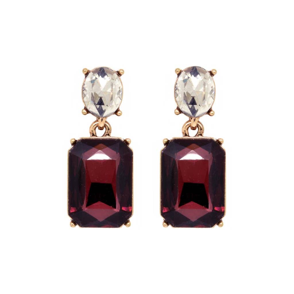 Pair of earrings with gemstones on a white background