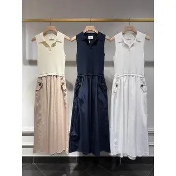 Three dresses on hangers against a neutral background