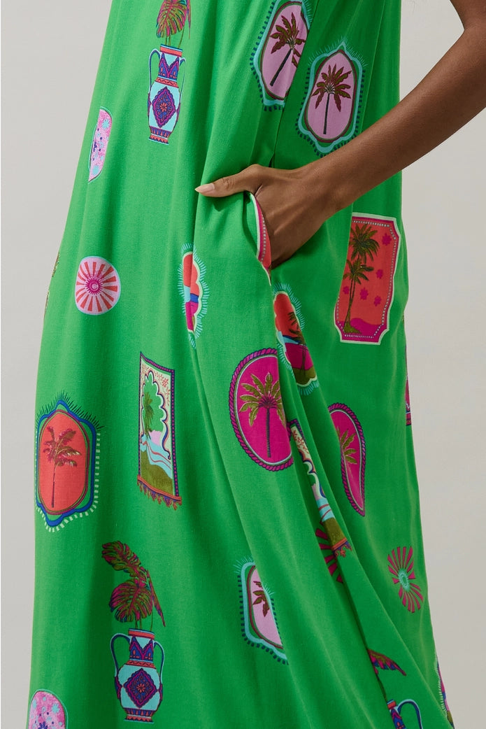 Green dress with colorful patterns on a plain background