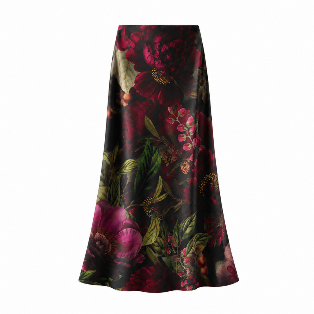 A high-waisted, A-line midi skirt featuring a rich, dark floral print with peonies and roses in deep red, magenta, and green on a black satin-like background, shown against a plain white studio backdrop.