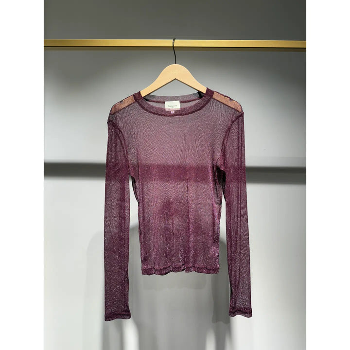 Purple long-sleeve shirt on a hanger against a gray background