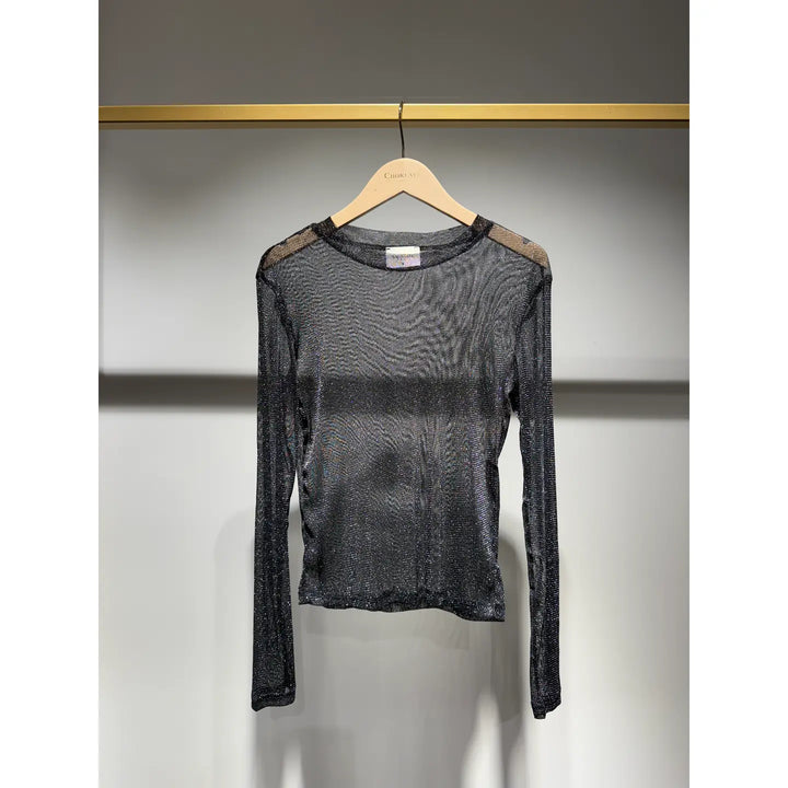 Black long-sleeve mesh top on a hanger against a gray background