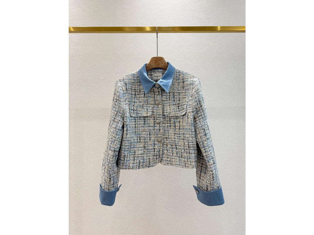 Plaid jacket with blue collar and cuffs on a white background
