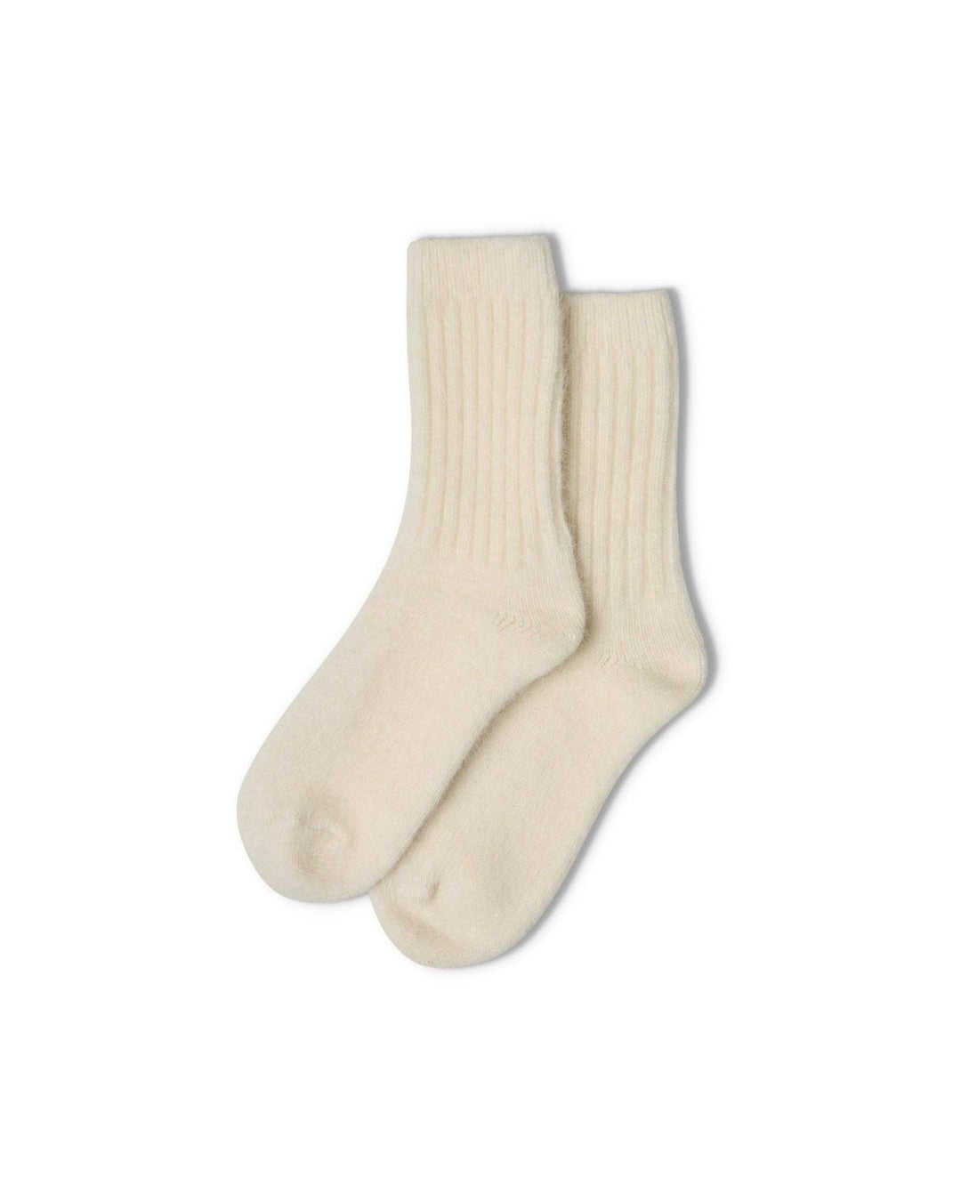 Pair of cream socks on a white background