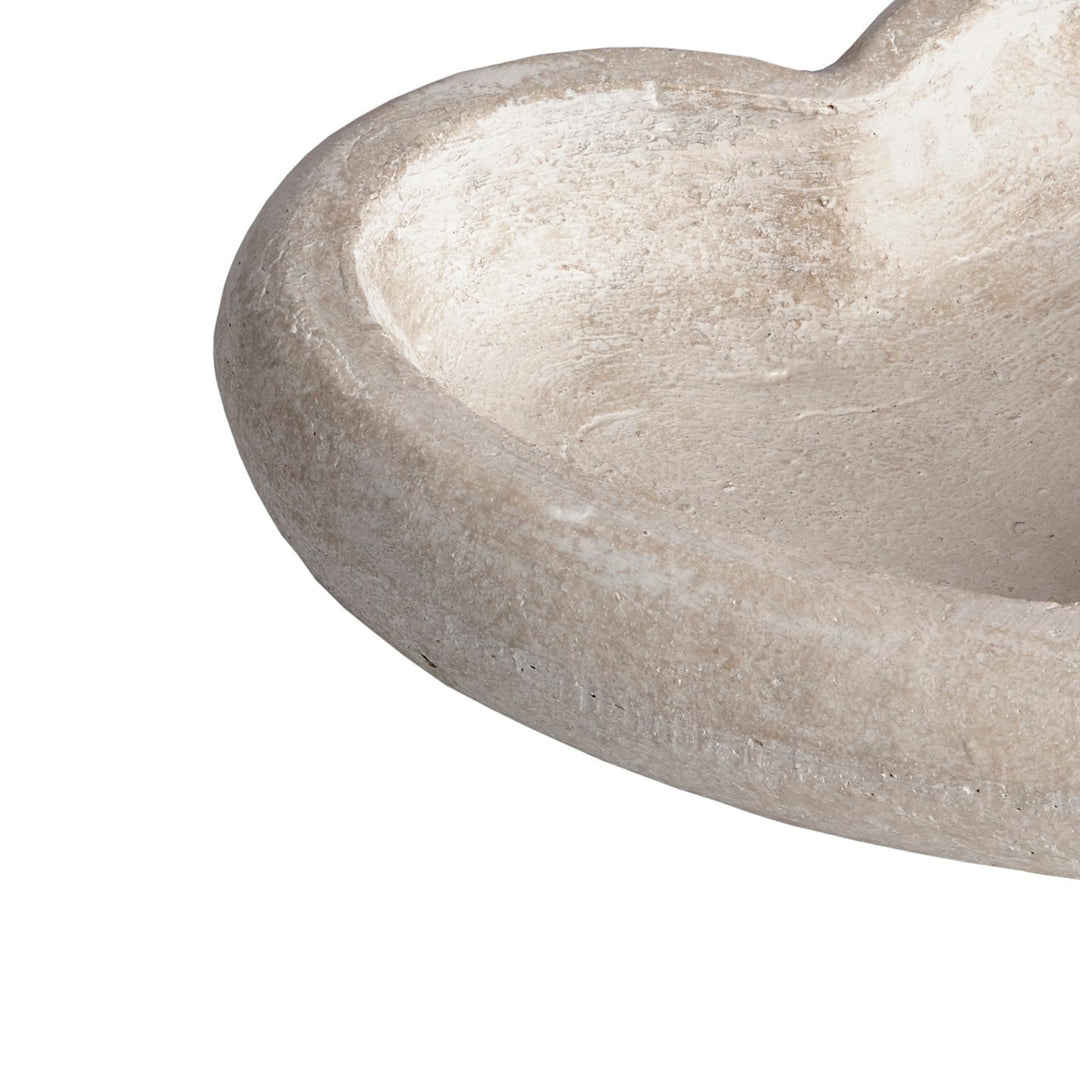 Close-up of a stone sink basin on a white background