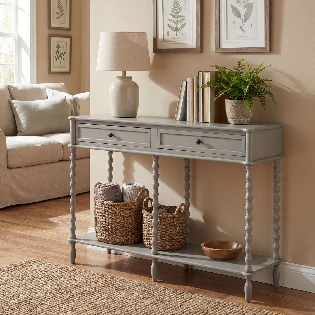 Gray console table in a living room with decor items