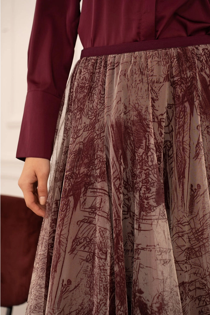 Close-up of a patterned skirt with a blurred background