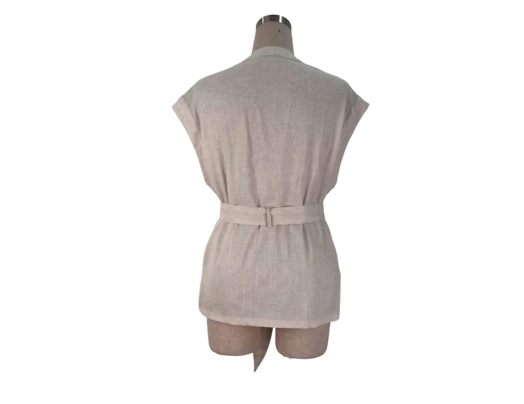 Beige romper on a mannequin against a white background