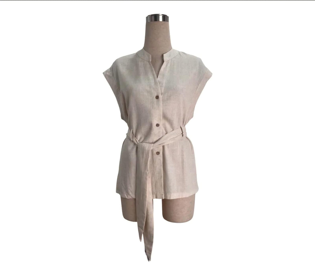 Beige romper on a mannequin against a white background