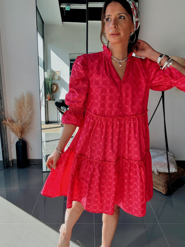 Woman wearing a red dress in an indoor setting
