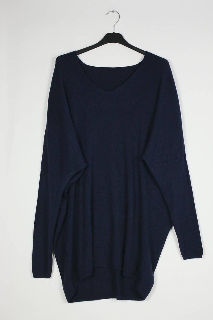 Navy blue sweater on a hanger against a white background