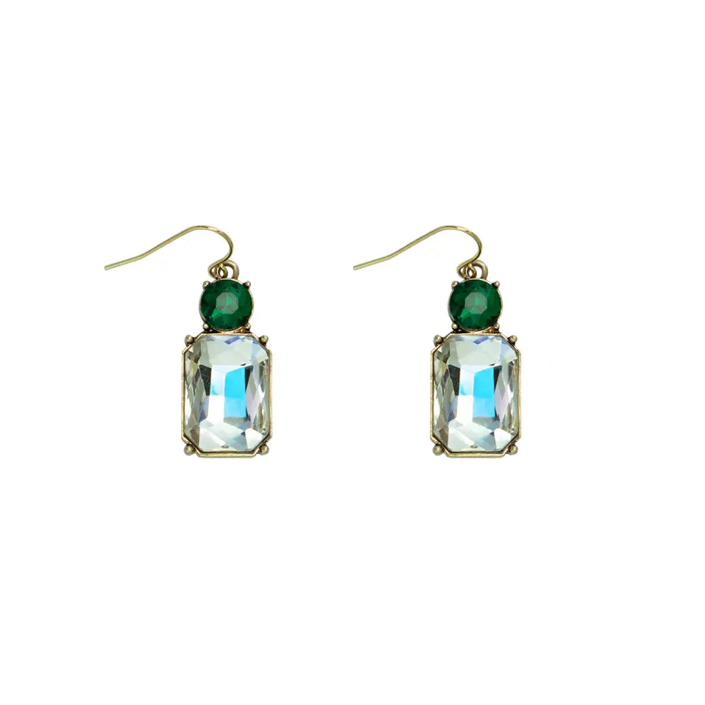 Pair of earrings with green gemstones and clear rectangular stones on a white background
