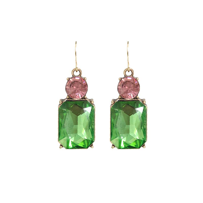 Pair of earrings with green and pink gemstones on a white background