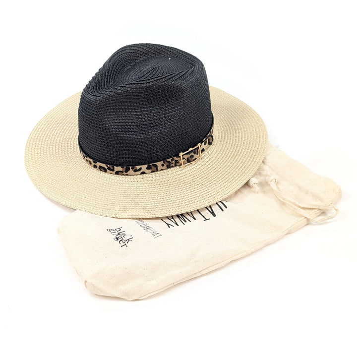 Two straw hats, one black and one beige, with a leopard print band, on a white background.