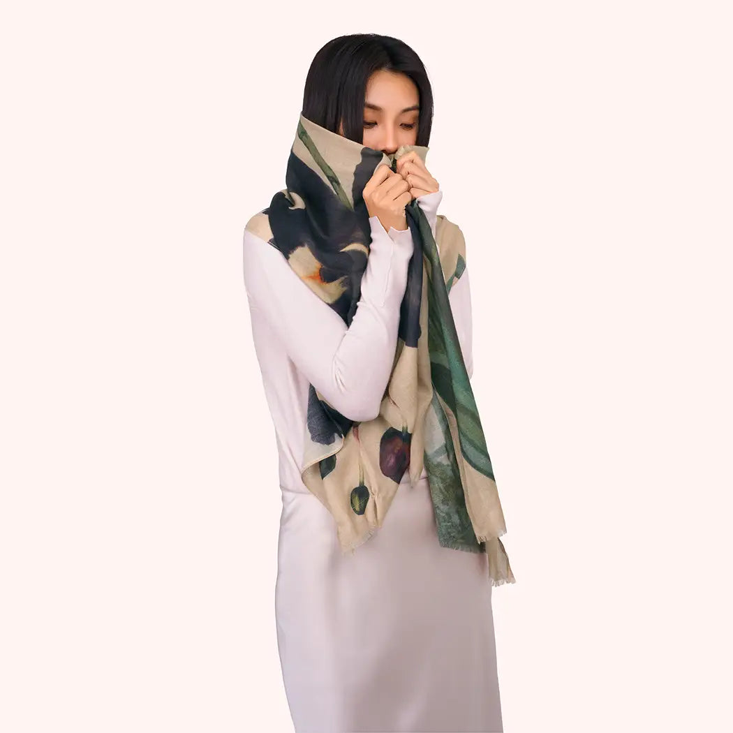 Woman wearing a floral scarf on a white background